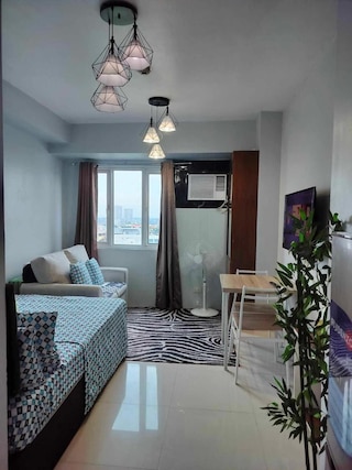 コージー スタジオ ユニット イン ケソンシティ ウィズ プライベートプール アンド シティビュー