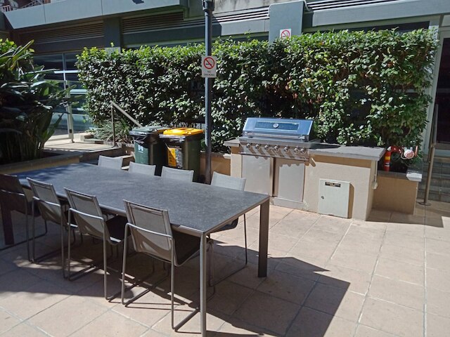 Unwind in Style at Melbourne's Historic Art Deco Apartment With Pool Gym Carpark