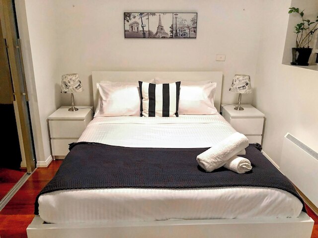 Unwind in Style at Melbourne's Historic Art Deco Apartment With Pool Gym Carpark