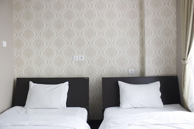 ダゴ スイーツ アパートメントにある ITB 大学近くのスタイリッシュなベッドルーム 1 室