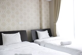 ダゴ スイーツ アパートメントにある ITB 大学近くのスタイリッシュなベッドルーム 1 室