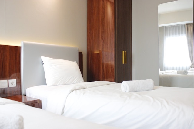 ザ グリーン コサンビ バンドン アパートメントにあるデラックスなベッドルーム 2 室