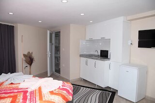 アザド・ホームズ・クムカピ54